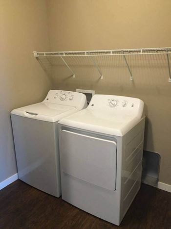 A washer and dryer sit next to each other in a laundry room